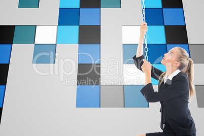 Composite image of businesswoman pulling a chain