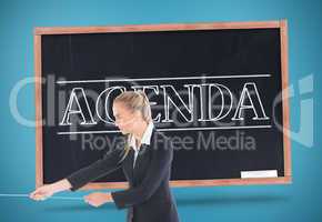 Composite image of businesswoman pulling a rope