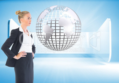 Composite image of businesswoman standing with hands on hips