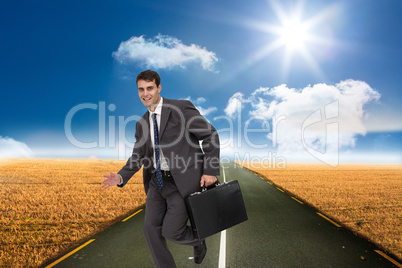 Composite image of smiling businessman in a hurry