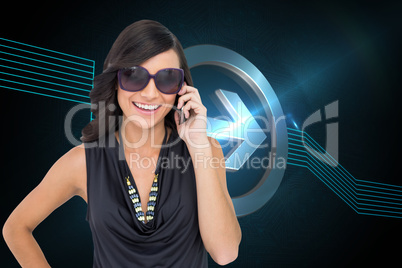 Composite image of happy brunette phoning