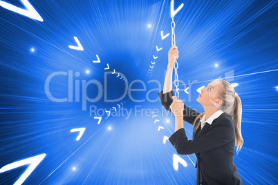 Composite image of businesswoman pulling a chain