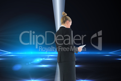 Composite image of businesswoman holding new tablet