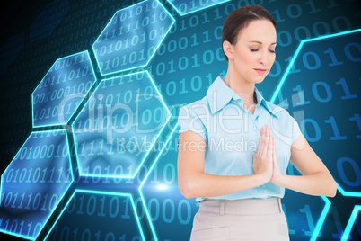 Composite image of peaceful young businesswoman praying