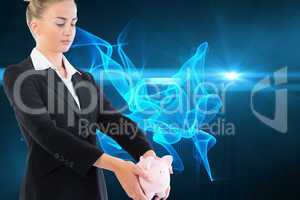 Composite image of businesswoman holding piggy bank