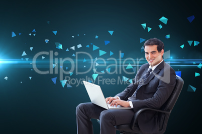 Composite image of young businessman sitting on an armchair work