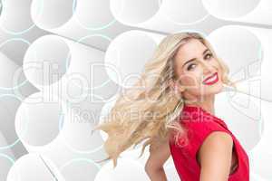 Composite image of smiling blonde standing hands on hips