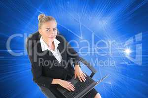 Composite image of businesswoman sitting on swivel chair with la