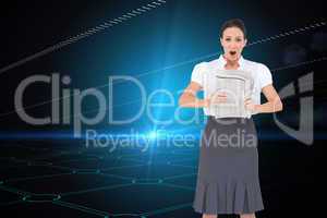 Composite image of shocked stylish businesswoman holding newspap