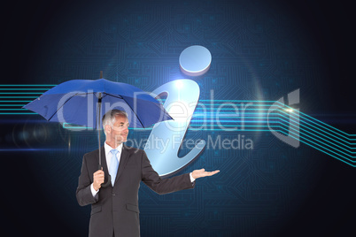 Composite image of happy businessman holding umbrella