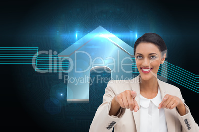 Composite image of smiling businesswoman pointing at the camera