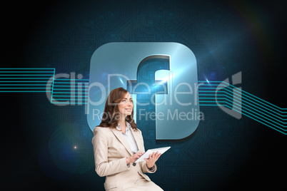 Composite image of businesswoman holding tablet and looking up