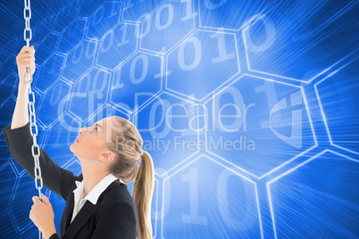 Composite image of businesswoman pulling a chain