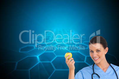 Composite image of happy surgeon holding an apple and smiling at