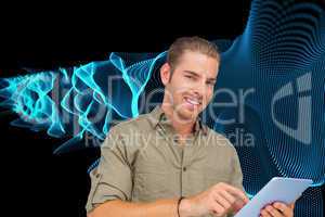 Composite image of happy man using tablet pc