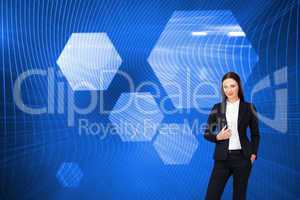 Composite image of portrait of a confident businesswoman standin