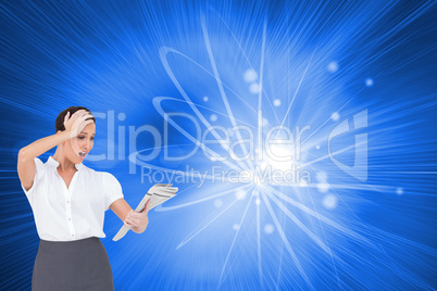 Composite image of surprised classy businesswoman holding newspa