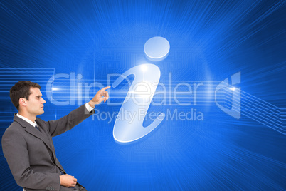 Composite image of businessman sitting and pointing the finger