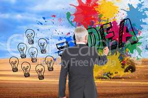 Composite image of rear view of businessman standing and writing