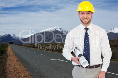 Composite image of cheerful young architect posing