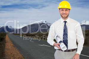 Composite image of cheerful young architect posing