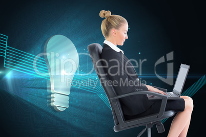 Composite image of businesswoman sitting on swivel chair with la