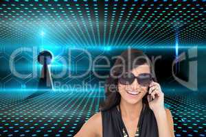 Composite image of happy brunette phoning