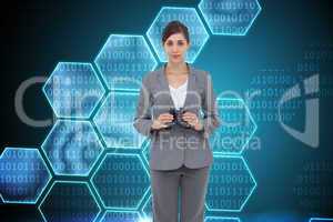 Composite image of young businesswoman with binoculars