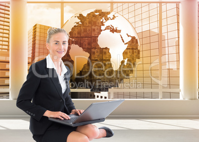 Composite image of businesswoman using laptop