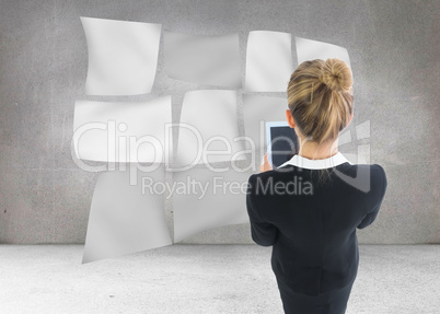 Composite image of businesswoman holding new tablet