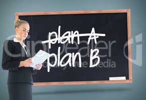 Composite image of businesswoman holding new tablet