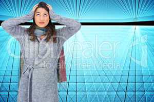 Composite image of anxious pretty brunette wearing winter clothe