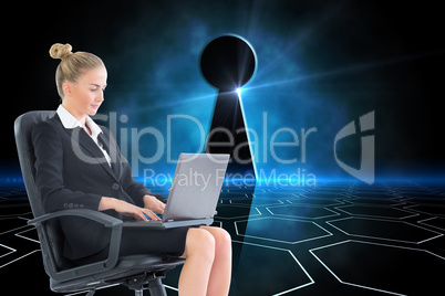 Composite image of businesswoman sitting on swivel chair with la