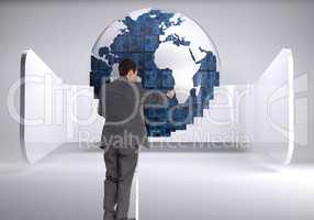 Composite image of businessman standing on ladder