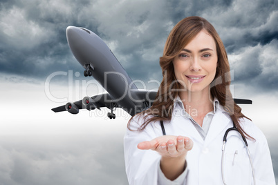 Composite image of portrait of female nurse holding out open pal