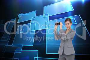 Composite image of businesswoman posing with binoculars