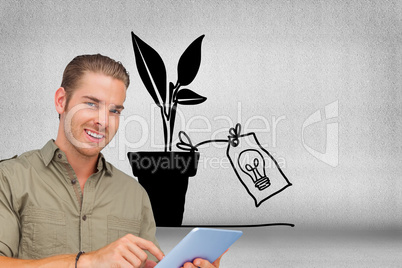 Composite image of happy man using tablet pc