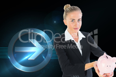 Composite image of businesswoman holding piggy bank