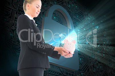 Composite image of businesswoman holding piggy bank