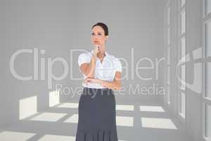 Composite image of pensive elegant businesswoman posing