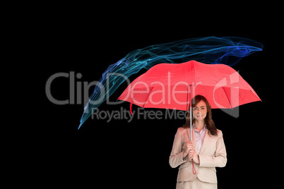 Composite image of attractive businesswoman holding red umbrella