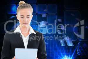 Composite image of businesswoman holding tablet