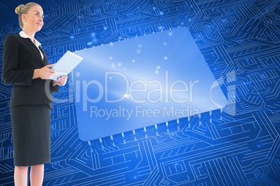 Composite image of businesswoman holding new tablet