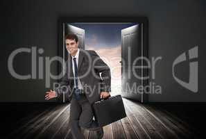 Composite image of smiling businessman in a hurry