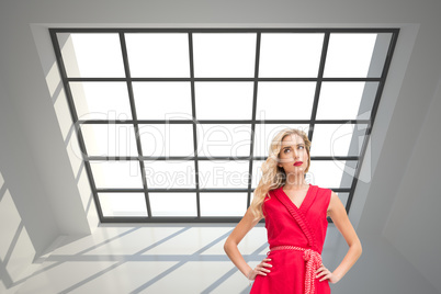 Composite image of elegant blonde standing hands on hips