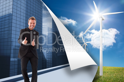 Composite image of businessman with thumbs up in a meeting