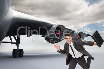 Composite image of smiling businessman in a hury