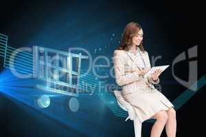 Composite image of happy businesswoman using tablet