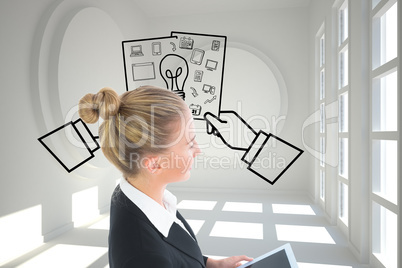 Composite image of businesswoman holding tablet