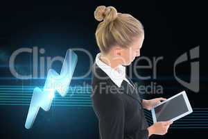 Composite image of businesswoman holding tablet